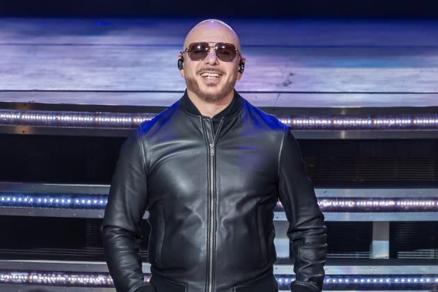 a man wearing sunglasses and a leather jacket