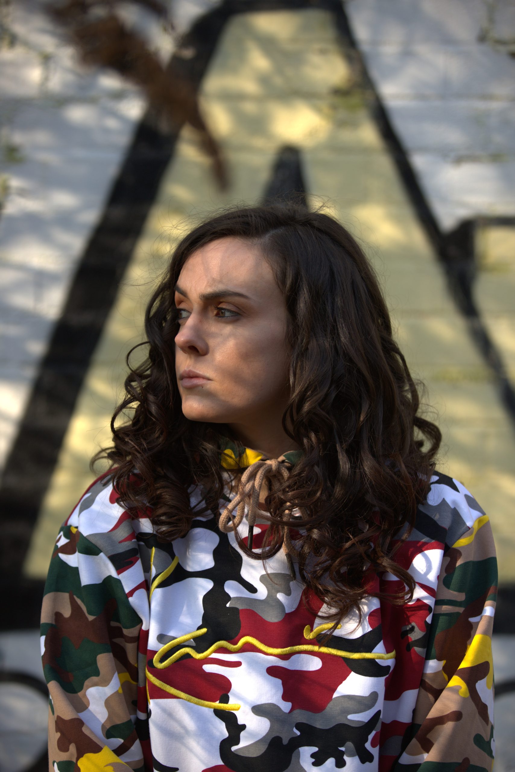 Abby Power outdoors wearing a patterned jacket