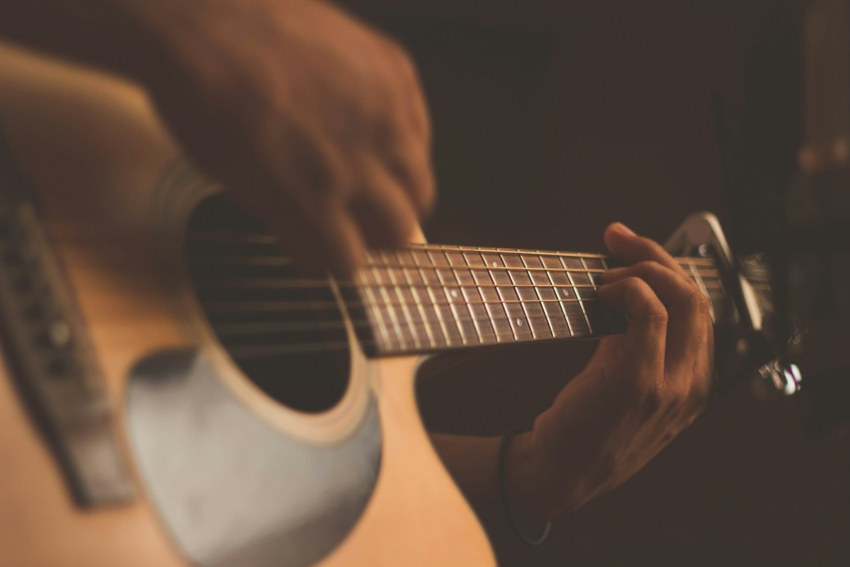 Acoustic guitar illustrating Zach Bryan and Lana Del Rey collaboration