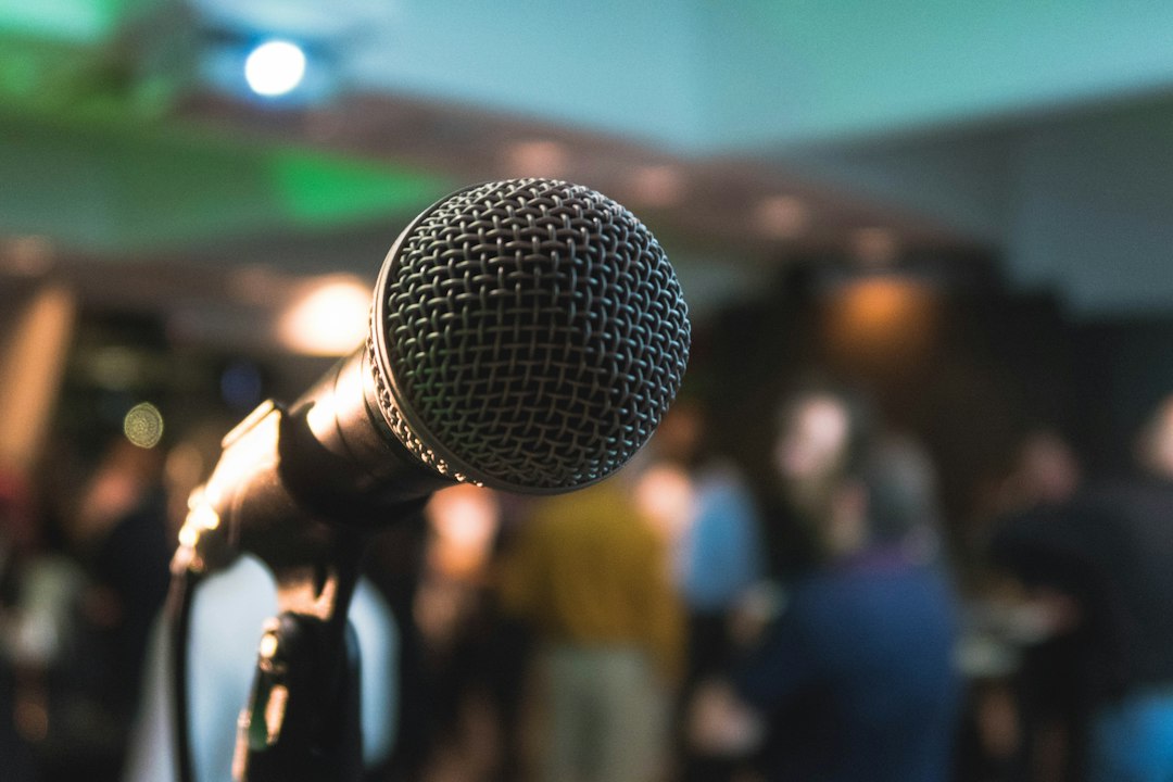 Stage microphone and audience lights, illustrating music awards and live performance