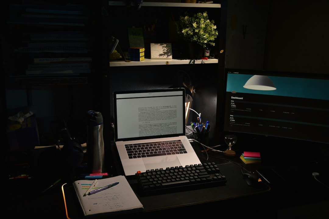 Laptop and creative workspace used to organize an artist press kit