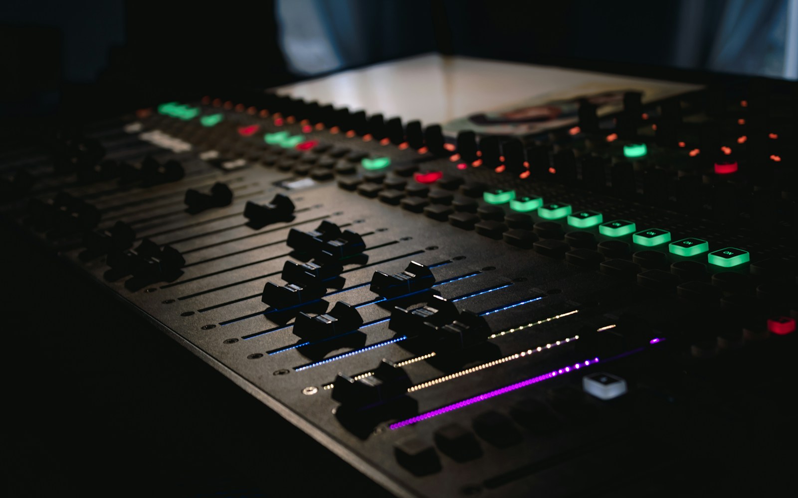 Illuminated controls on an audio mixing console