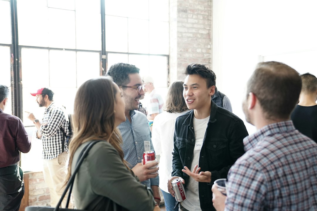 People talking after an event, representing music industry networking