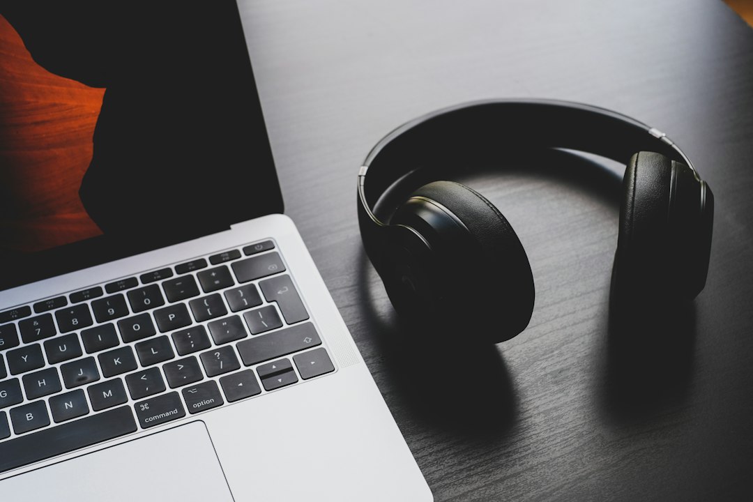 Headphones beside a laptop, representing independent artist release planning
